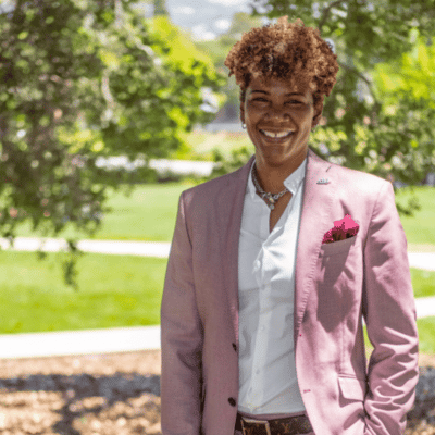 Dr. Lori A. Watson standing outside under the trees