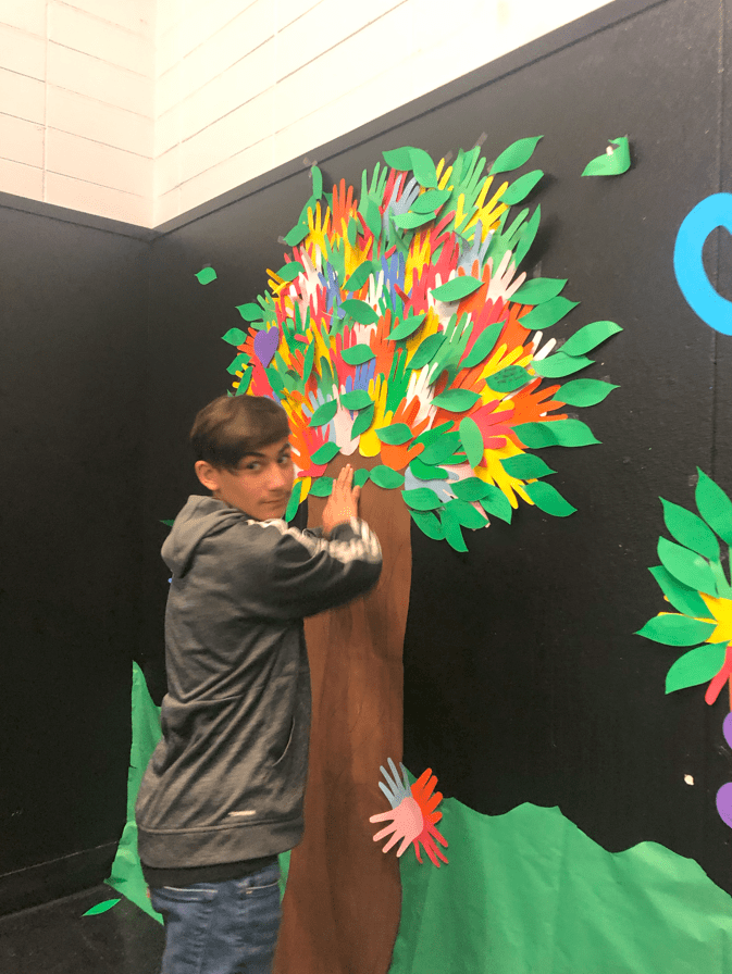 NOEA Day 2020 Student working on Wall Mural at McKinley Stockton HealthNet
